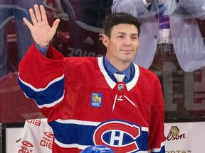 Carey Price waves at the Bell Centre crowd while wearing a Canadiens jersey