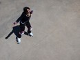 A woman on roller skates, shot from above
