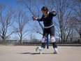 A woman rollerblades in a park