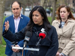 Ensemble Montréal city councillors Stéphanie Valenzuela, front, and Sonny Moroz are joined by Quebec Liberal MNA Elizabeth Prass at a press conference in Martin-Luther-King Park in Montreal on Friday, May 3, 2024.