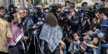 Representatives of the protest camp at McGill University meet with the media on the university grounds in Montreal on Monday, May 6, 2024.