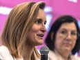 Marie-Philip Poulin speaks into a microphone during a news conference
