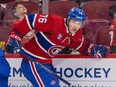 Jared Davidson in a red Canadiens jersey skates along the boards