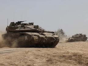Israeli tanks roll near the border with the Gaza Strip on May 2.