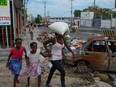 People flee their neighborhoods after after armed gangs terrorized the Delmas 24 and Solino areas on the night of May 1, in Port-au-Prince, Haiti, May 2 ,2024.