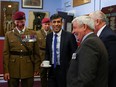Britain's Prime Minister Rishi Sunak reacts as he meets with families of the Parachute Regiment.