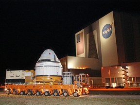 A Boeing CST-100 Starliner spacecraft departs the Boeing Commercial Cargo and Processing Facility in the pre-dawn hours after the Vehicle Assembly Building at Kennedy Space Center in Cape Canaveral, Florida, April 16, 2024.