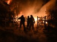 Ukrainian firefighters work to extinguish a fire at the site of a drone attack on industrial facilities in Kharkiv on Saturday, May 4, 2024, amid the Russian invasion of Ukraine.