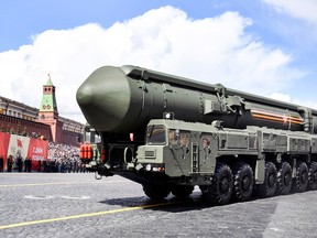 A Russian Yars intercontinental ballistic missile launcher parades through Red Square.