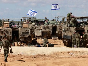 Israeli army tanks take position in southern Israel near the border with the Gaza Strip on May 6, 2024, amid the ongoing conflict between Israel and the Palestinian Hamas movement.