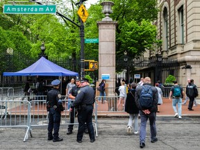 New York Police officers stand at the entrance of Columbia University in New York City on May 6, 2024.