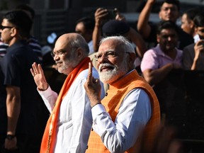 Indian Prime Minister Narendra Modi, right, and Home Minister Amit Shah.
