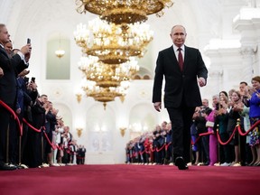 Russian president-elect Vladimir Putin walks prior to his inauguration ceremony at the Kremlin in Moscow on May 7, 2024.