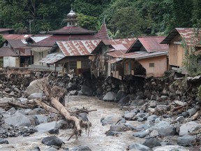 Damaged houses are seen after flash floods and cold lava flow from a volcano in Tanah Datar, West Sumatra, on May 12, 2024.