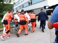 Picture taken on May 15, 2024 shows Slovak Prime Minister Robert Fico being transported by medics and his security detail to the hospital in Banska Bystrica, Slovakia where he is to be treated after he had been shot "multiple times."