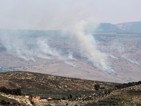 Smoke billows at the site of a rocket strike from Lebanon on the Israel-annexed Golan Heights.