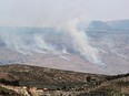 Smoke billows at the site of a rocket strike from Lebanon on the Israel-annexed Golan Heights.