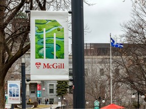 A McGill University banner and a Quebec flag are shown at the university's downtown campus