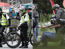 Left: Montreal police stand outside the McGill campus on Wednesday May 1, 2024. (Pierre Obendrauf/Montreal Gazette)
Right: Police take demonstrators into custody on the Art Institute of Chicago campus on May 04, 2024 in Chicago, Illinois. (Scott Olson/Getty Images)