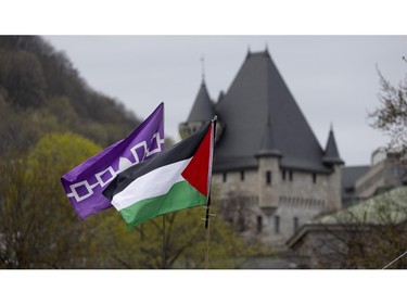The Mohawk 5 Nations flag and Palestinian flag fly over the pro-Palestinian encampment at McGill University in Montreal on Saturday, May 4, 2024.