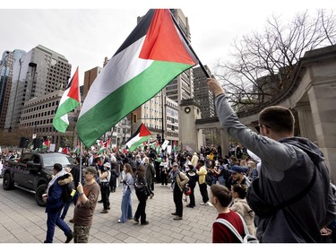 People gather outside the Roddick Gates at McGill University during a pro-Palestinian demonstration in Montreal on Saturday, May 4, 2024.