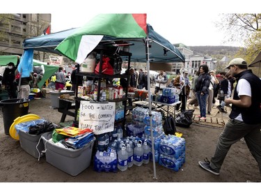 A community food and water station is seen at the pro-Palestinian encampment on McGill's lower field in Montreal on Saturday, May 4, 2024.