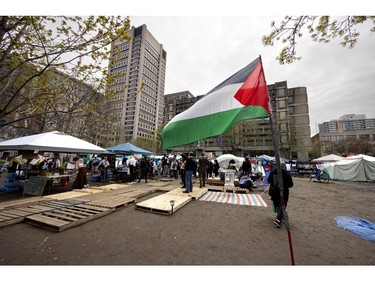 A Palestinian flag flies outside the encampment on McGill's lower field in Montreal on Saturday, May 4, 2024.