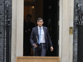 Britain's Prime Minister Rishi Sunak walks from 10 Downing Street to speak to the media in London Wednesday, May 22, 2024, as he announces that he is to call a General Election for July 4.