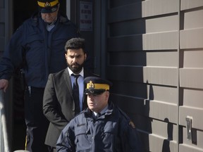 Jaskirat Singh Sidhu is taken out of the Kerry Vickar Centre by the RCMP following his sentencing for the crash, in Melfort, Sask.,on March 22, 2019.