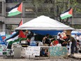 A tent with free supplies is seen at the pro-Palestinian encampment on McGill University campus Monday, May 6, 2024 in Montreal. Lawyers for McGill University will be going to court today seeking a court injunction to dismantle the pro-Palestinian encampment that has been erected on its grounds since last month.