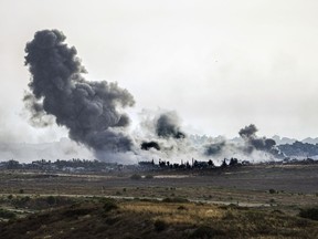 Smoke rises following an Israeli airstrike in the Gaza Strip, as seen from southern Israel, Friday, May 17, 2024.