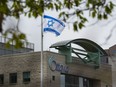 The Israeli flag flies in front of Ottawa City Hall after it was raised during a private event on Tuesday, May 14, 2024.