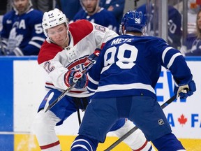 Canadiens' Owen Beck is seen trying to get past Maple Leafs defenceman Victor Mete during a pre-season game in 2022.