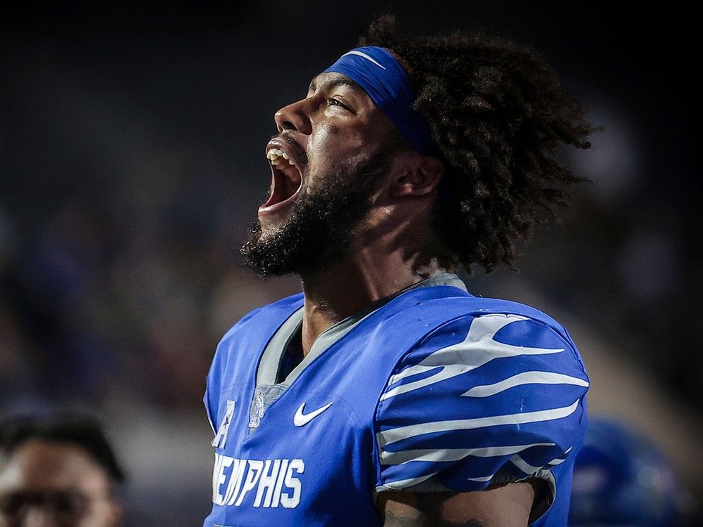 Memphis linebacker Geoffrey Cantin-Arku celebrates a turnover by Navy in 2023 in Memphis.