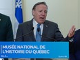 François Legault speaks at a podium with the name of Quebec's new history museum
