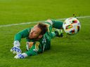 CF Montreal goalkeeper Jonathan Sirois (40) attempts to make a save during first half MLS soccer action against Toronto FC in Toronto, Saturday, May 18, 2024.