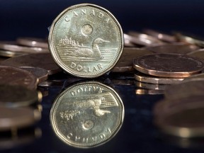 The Canadian dollar coin, the Loonie, is displayed in Montreal, Jan. 30, 2015.