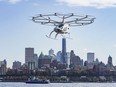 The Volocopter 2X, an electric vertical takeoff and landing (eVTOL) aircraft, flies during a demonstration of eVTOLs in a test flight, in New York, Monday, Nov. 13, 2023.