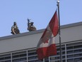 Canadian soldiers stand guard on the rooftop of their embassy in Port-au-Prince, Haiti, Wednesday, April 10, 2024.