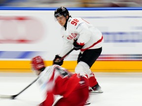 Connor Bedard had two goals and one assist in helping lead Canada to a 5-1 win over Denmark on Sunday at the world hockey championship. Bedard controls the puck during the preliminary round match between Denmark and Canada at the Ice Hockey World Championships in Prague, Czechia, Sunday, May 12, 2024.