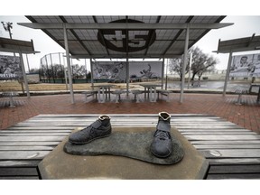 Only the feet are left of a statue of Jackie Robinson that was stolen