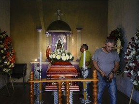 Mourners attend the wake of mayoral candidate Armando Perez in Maravatio, Michoacan state, Mexico, on Tuesday, Feb. 27, 2024.