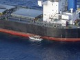 In this undated photo provided by the État Major des Armées on Thursday, May 30, 2024, a view of the Laax, a Greek-owned, Marshall Islands-flagged bulk carrier that came under attack by Yemen's Houthi rebels earlier this week, carrying cargo of grain bound for Iran, the group's main benefactor, authorities said Thursday.
