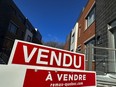 The Quebec Professional Association of Real Estate Brokers says Montreal-area home sales surged 25.5 per cent in April compared with the same month last year, with levels returning to historical averages for this time of year.THE CANADIAN PRESS/Christinne Muschi