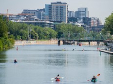 People kayak on the Lachine Canal