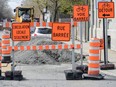 Construction cones are shown next to a construction site in Montreal.