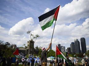 Demonstrators stage a protest at a pro-Palestinian encampment at the University of Toronto in Toronto, on Thursday, May 23, 2024.