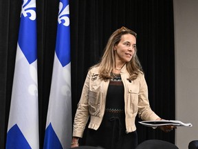 Quebec Housing Minister France-Élaine Duranceau walks in to explain legislation on housing at a news conference, Wednesday, May 22, 2024 at the legislature in Quebec City.