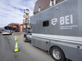 Quebec's highest court says municipal officers have the right to remain silent during investigations by the independent police watchdog. A BEI truck, Quebec's independent police bureau, is seen as investigators examine the scene in Louiseville, Que., Tuesday, March 28, 2023.