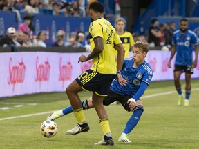 CF Montréal's Bryce Duke, right, reaches in to steal the ball from Nashville SC's Anibal Godoy
